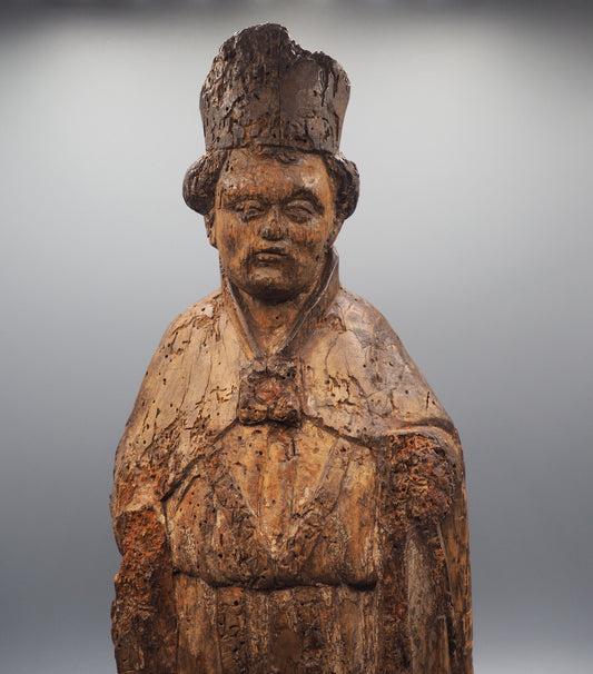 Rare and impressive carved walnut figure of a Bishop, probably France, 15th century.