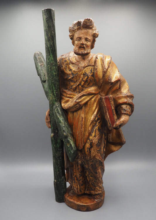 A parcel-gilt and polychrome carved walnut figure of Saint Andrew